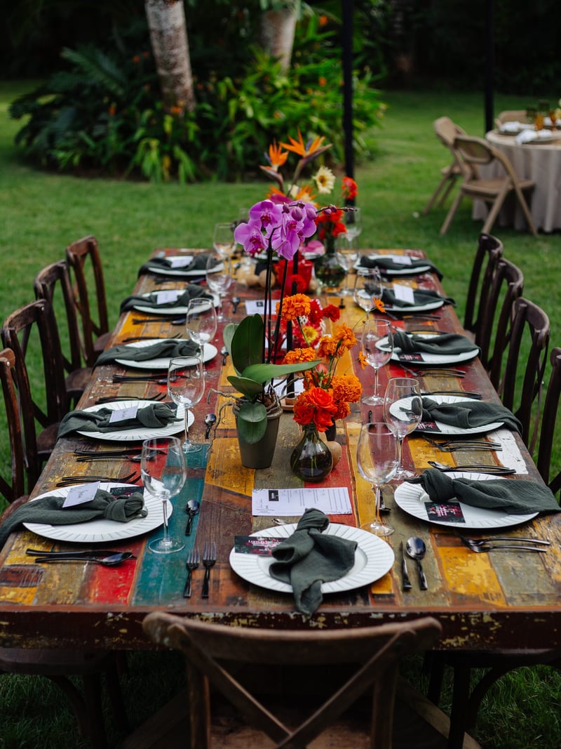 Colorful reclaimed wood table with orchids