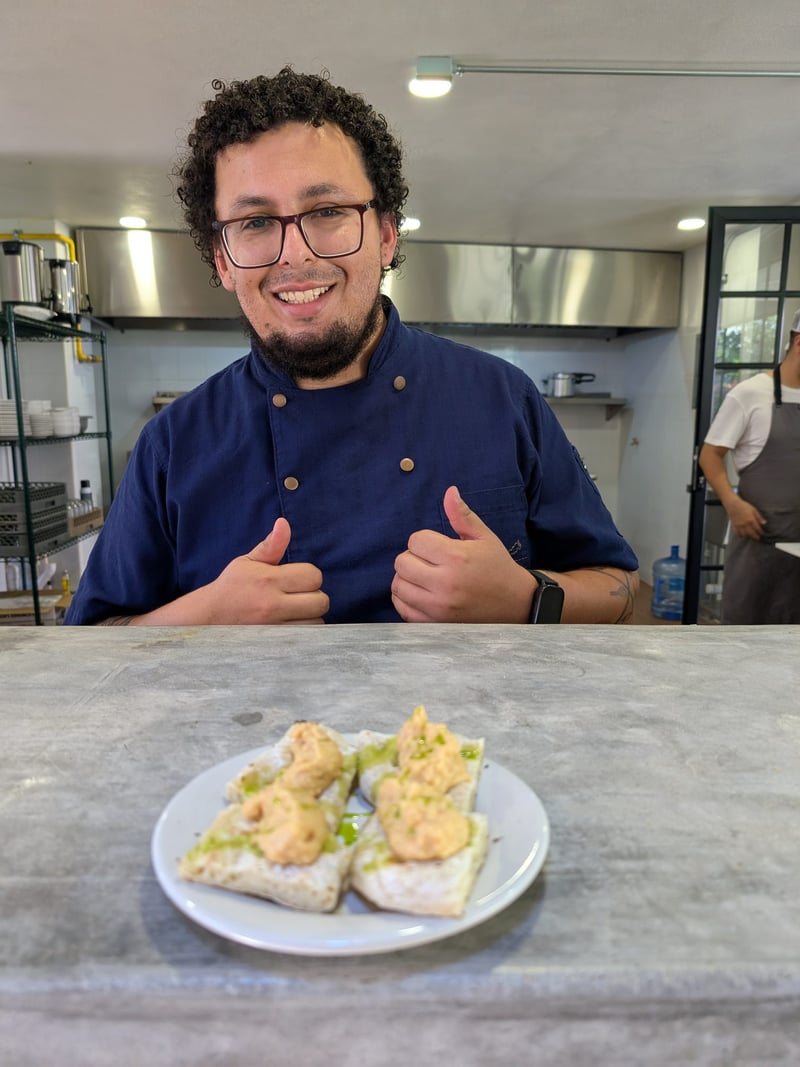 Chef presenting a finished dish