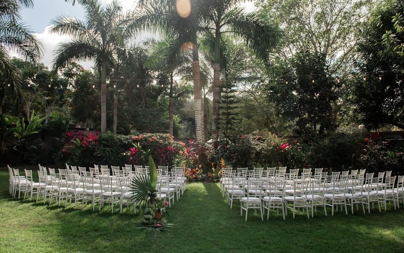 Ceremony setup with white chairs